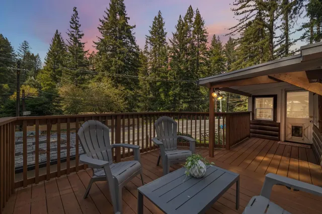 a view of deck with table and chairs and wooden floor
