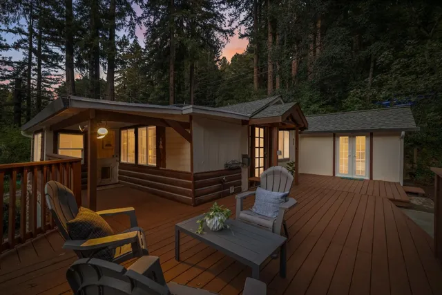 a view of balcony with furniture and trees around