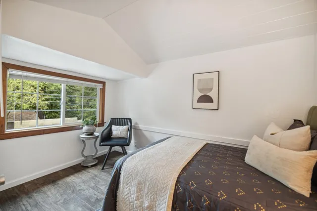 a room with a bed and a window