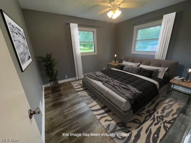 2345 Antioch Road Perry, OH 44081 - Photo 9 of 17 Bedroom featuring ceiling fan and dark wood-type flooring