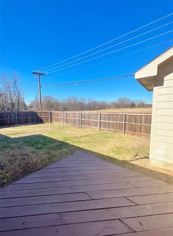 a view of a swimming pool with a yard