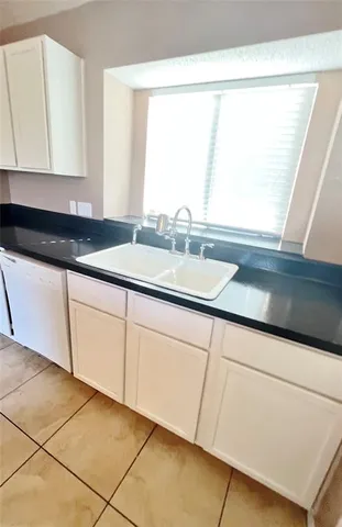 a bathroom with a sink and a window