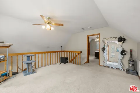 a view of livingroom with hardwood floor and a ceiling fan