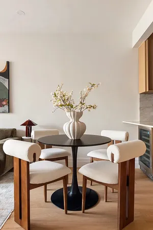 a kitchen with stainless steel appliances granite countertop a sink a stove and white cabinets