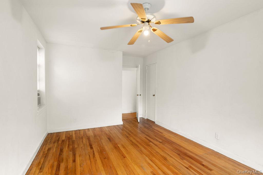 485 Bronx River Road, Unit A21 Yonkers, NY 10704 - Photo 11 of 18 a view of empty room with wooden floor