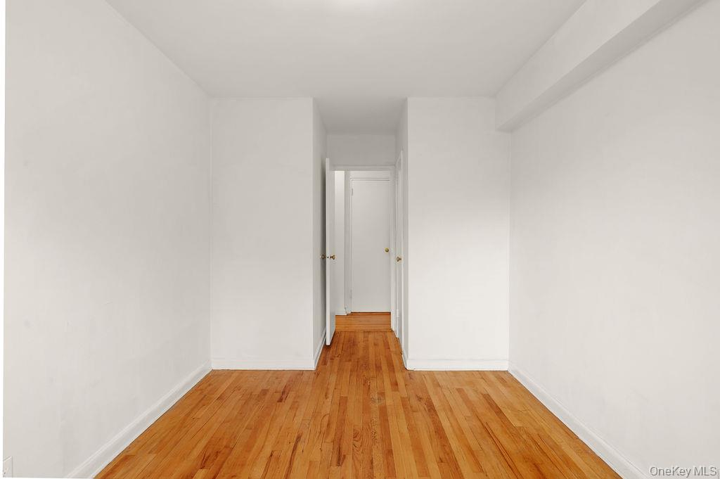 485 Bronx River Road, Unit A21 Yonkers, NY 10704 - Photo 13 of 18 a bedroom with a bed and a window