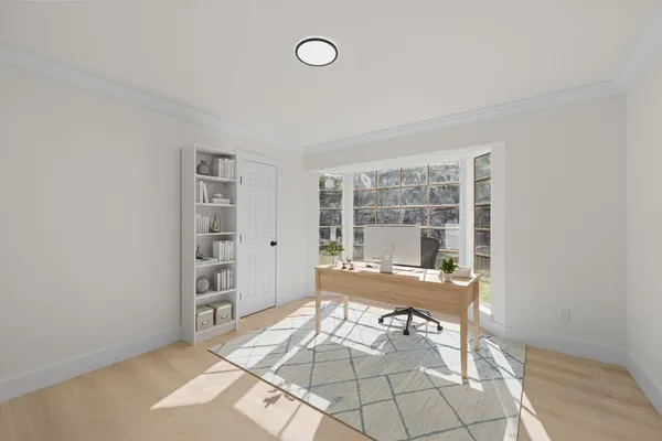 a view of a room with windows and lounge chair