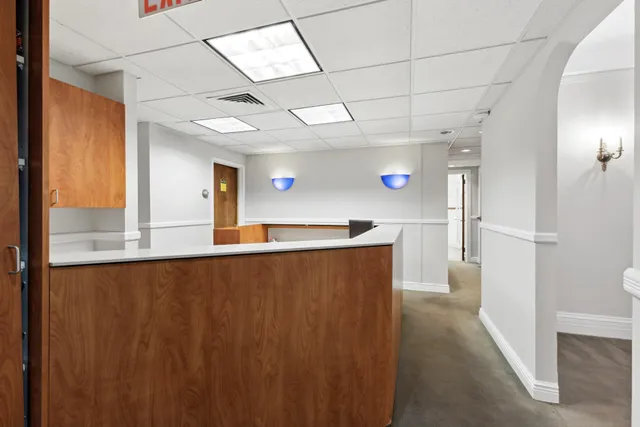 a view of a living room with a wooden floor