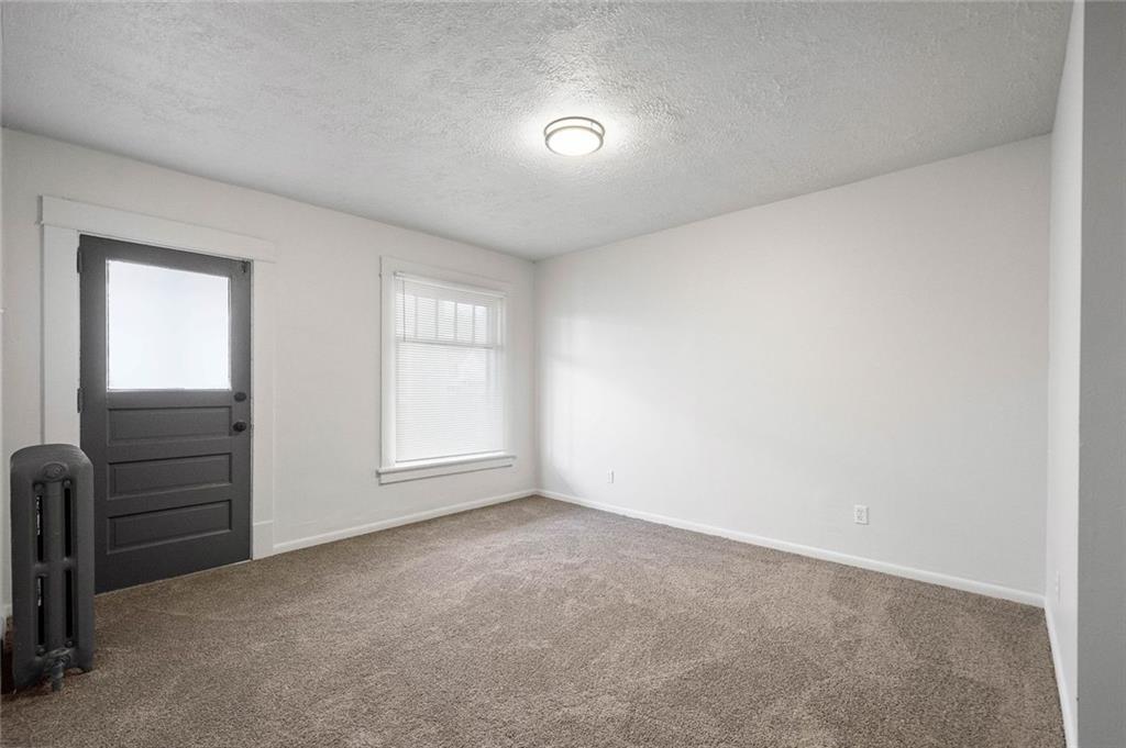 306 Park Road Ambridge, PA 15003 - Photo 15 of 43 an empty room with furniture and windows