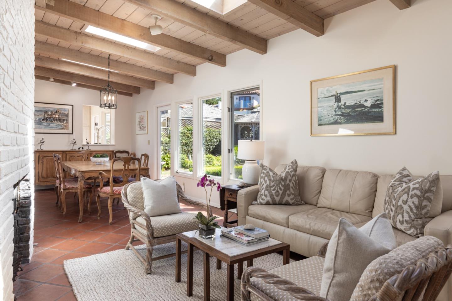26177 Scenic Road Carmel, CA 93923 - Photo 17 of 30 a living room with furniture a wooden floor and a large window