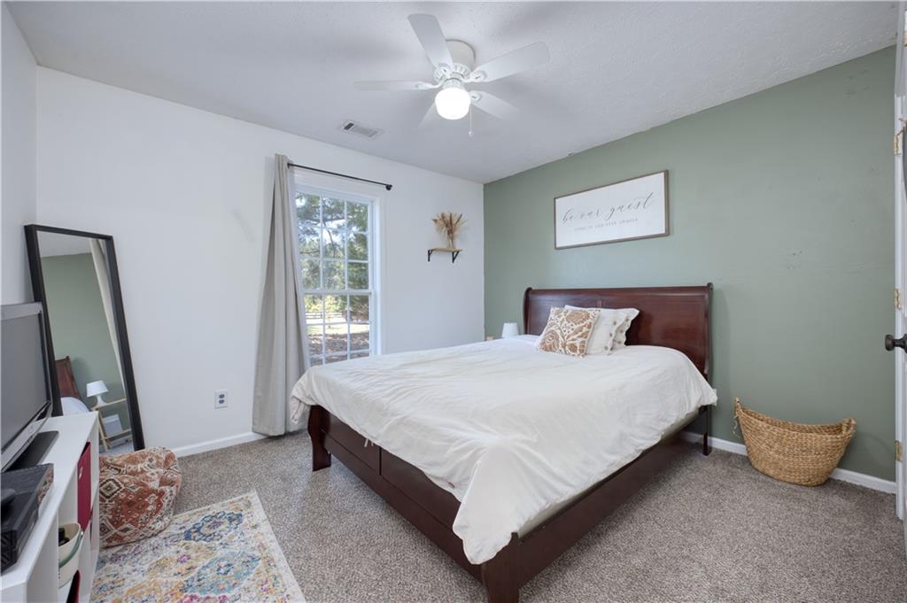25 Lee Road Salem, AL 36874 - Photo 13 of 30 Carpeted bedroom with a ceiling fan and baseboards