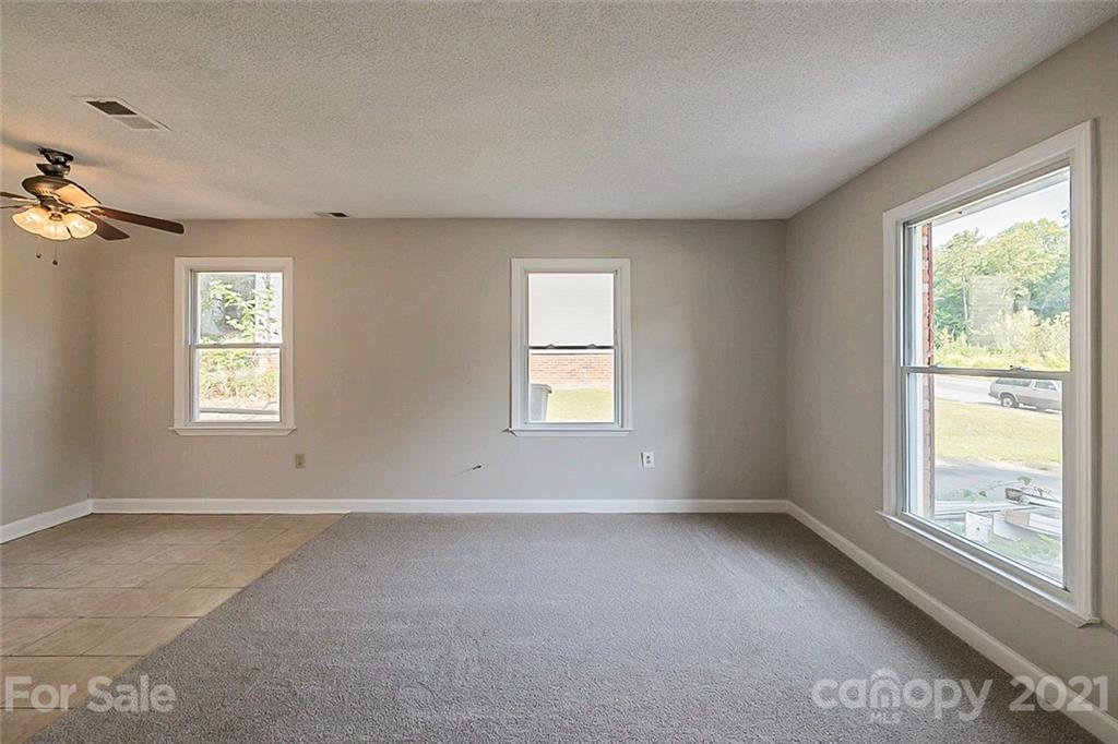 922 Capps Hill Mine Road Charlotte, NC 28216 - Photo 3 of 10 a view of an empty room with a window