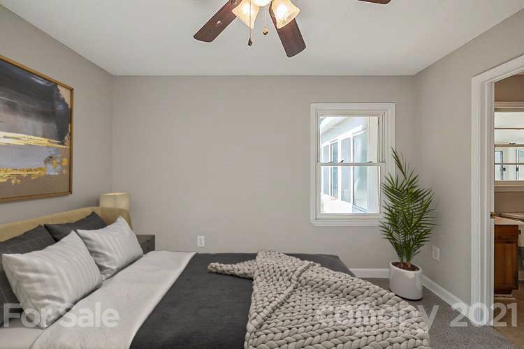 922 Capps Hill Mine Road Charlotte, NC 28216 - Photo 5 of 10 a bedroom with a bed and a window