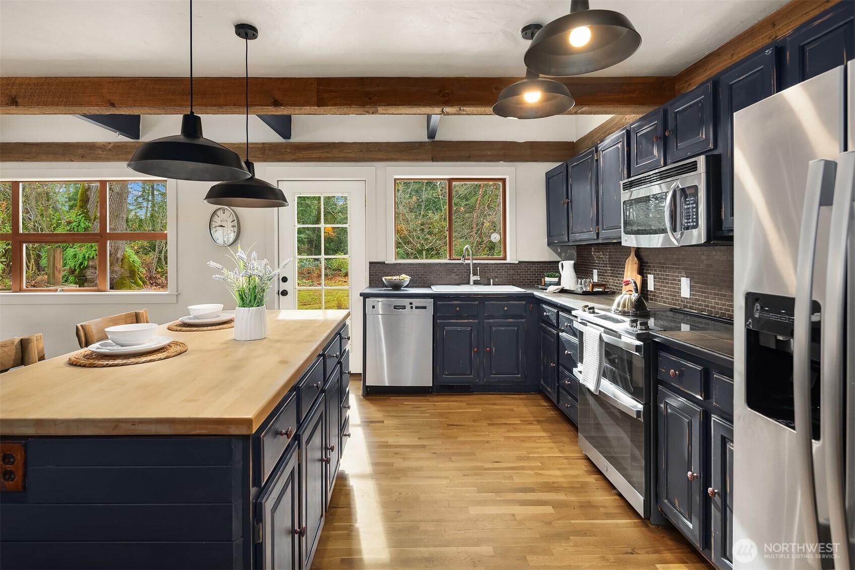 41715 Southeast 101st Street North Bend, WA 98045 - Photo 12 of 38 a kitchen with stainless steel appliances granite countertop a sink a stove and a refrigerator
