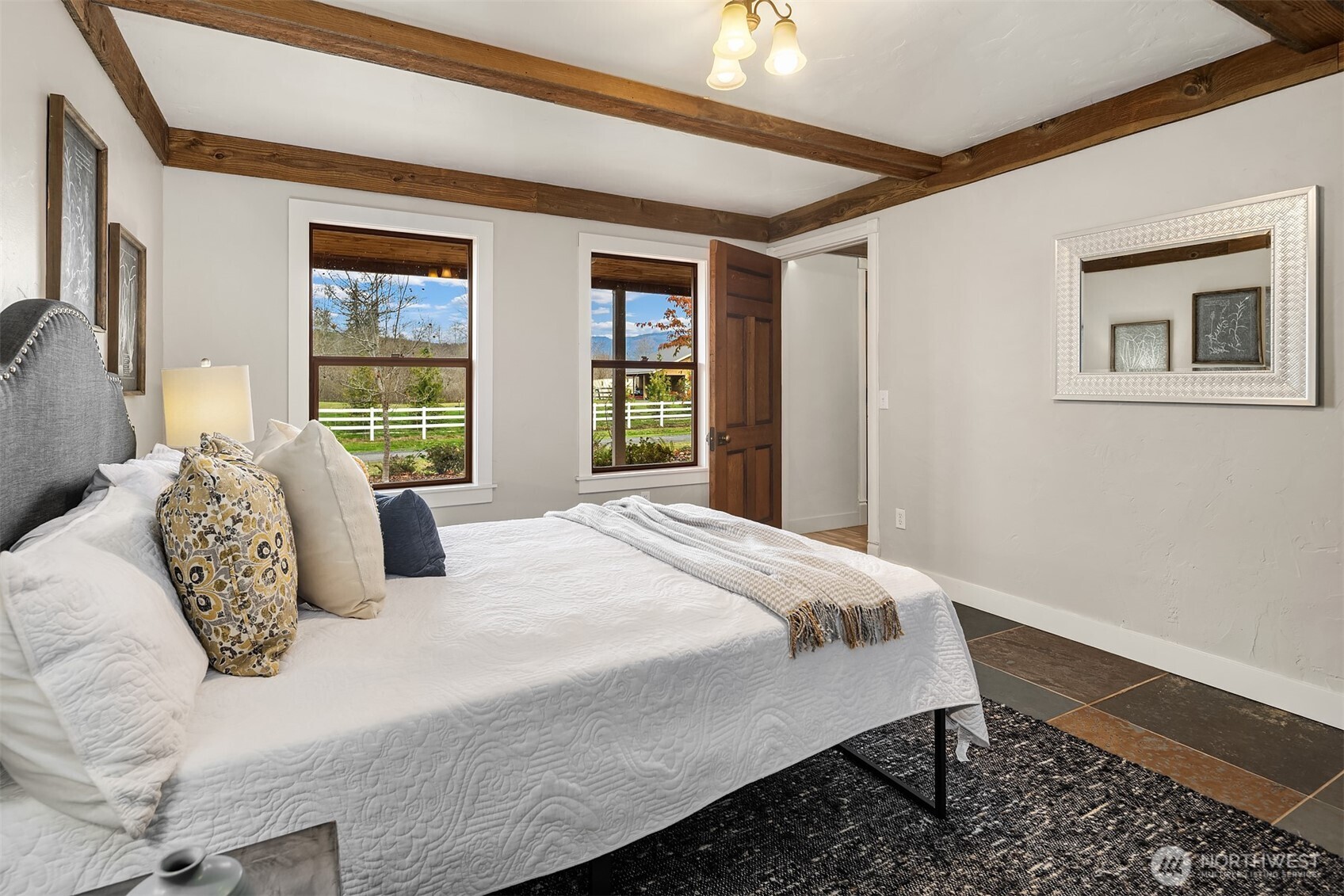 41715 Southeast 101st Street North Bend, WA 98045 - Photo 19 of 38 a bedroom with a large bed and a window