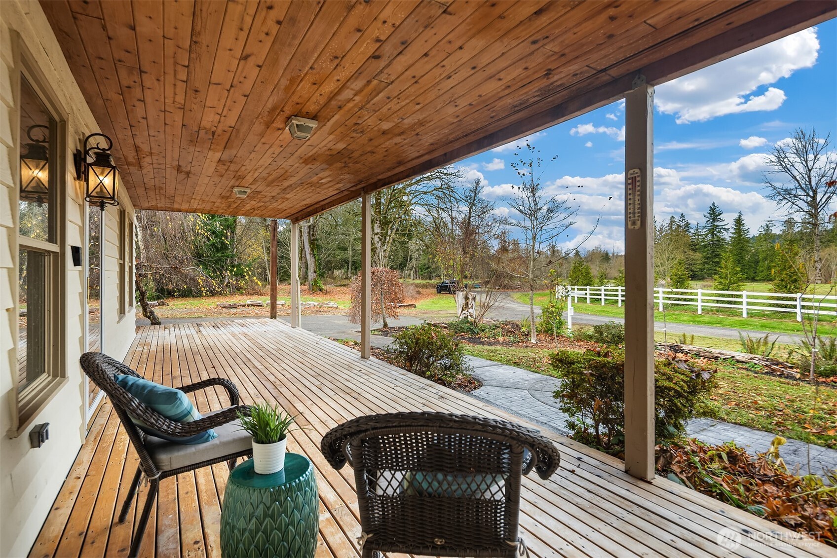 41715 Southeast 101st Street North Bend, WA 98045 - Photo 2 of 38 a view of a patio with a table chairs and wooden fence