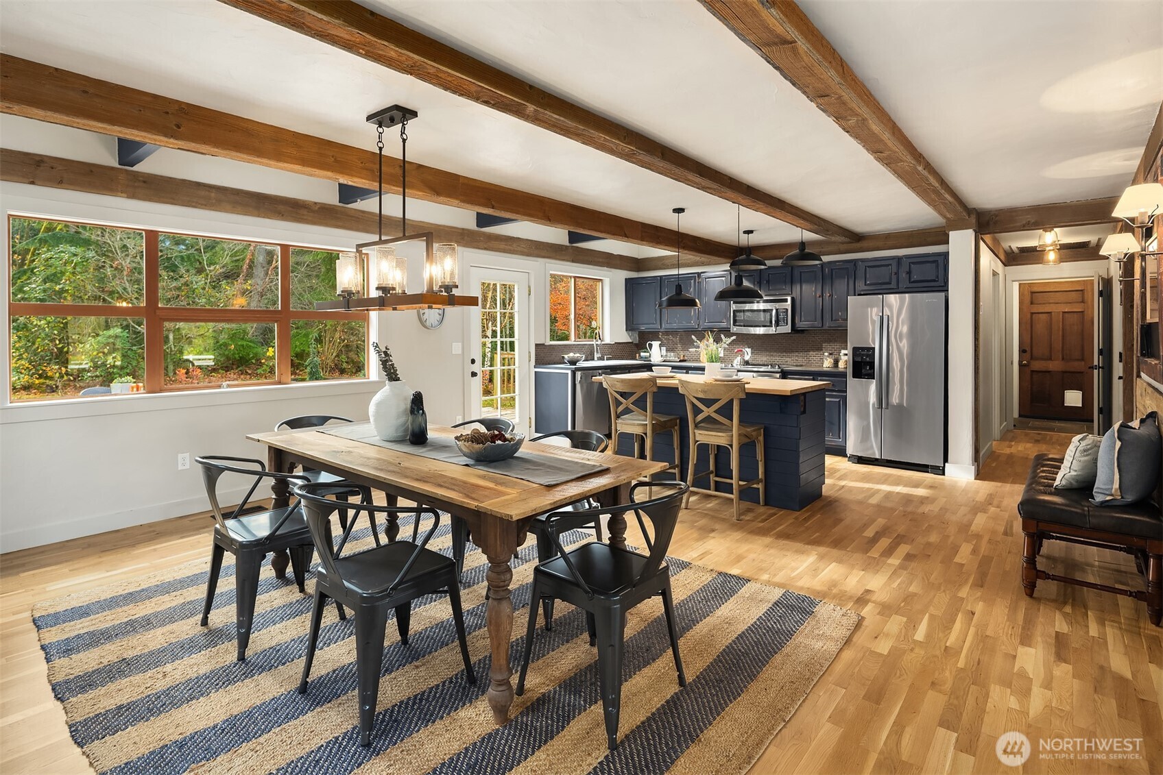 41715 Southeast 101st Street North Bend, WA 98045 - Photo 8 of 38 a view of a dining room with furniture window and wooden floor