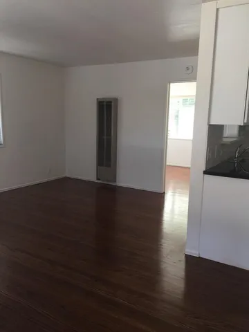 a view of a livingroom with wooden floor