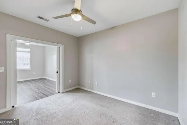 an empty room with a bathroom