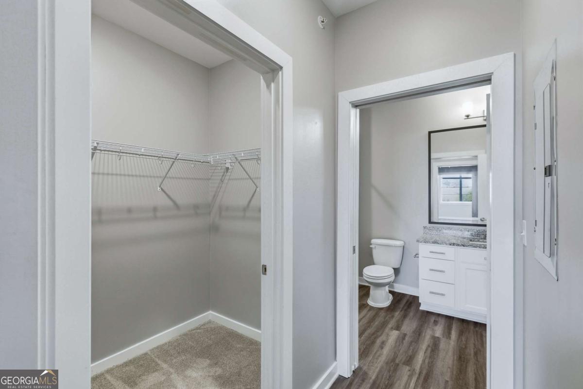 100 Prince Avenue, Unit A404 Athens, GA 30601 - Photo 19 of 27 a bathroom with a glass shower door