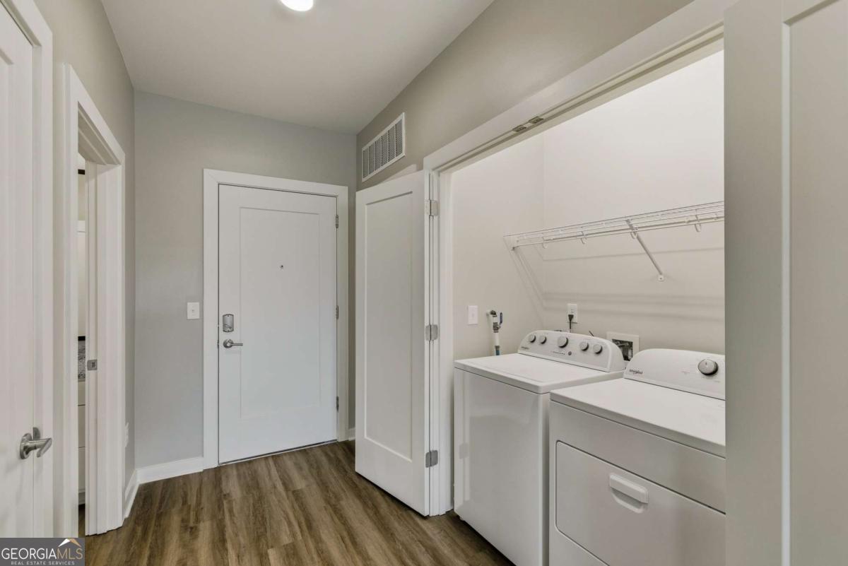 100 Prince Avenue, Unit A404 Athens, GA 30601 - Photo 22 of 27 a bathroom with a sink and a mirror