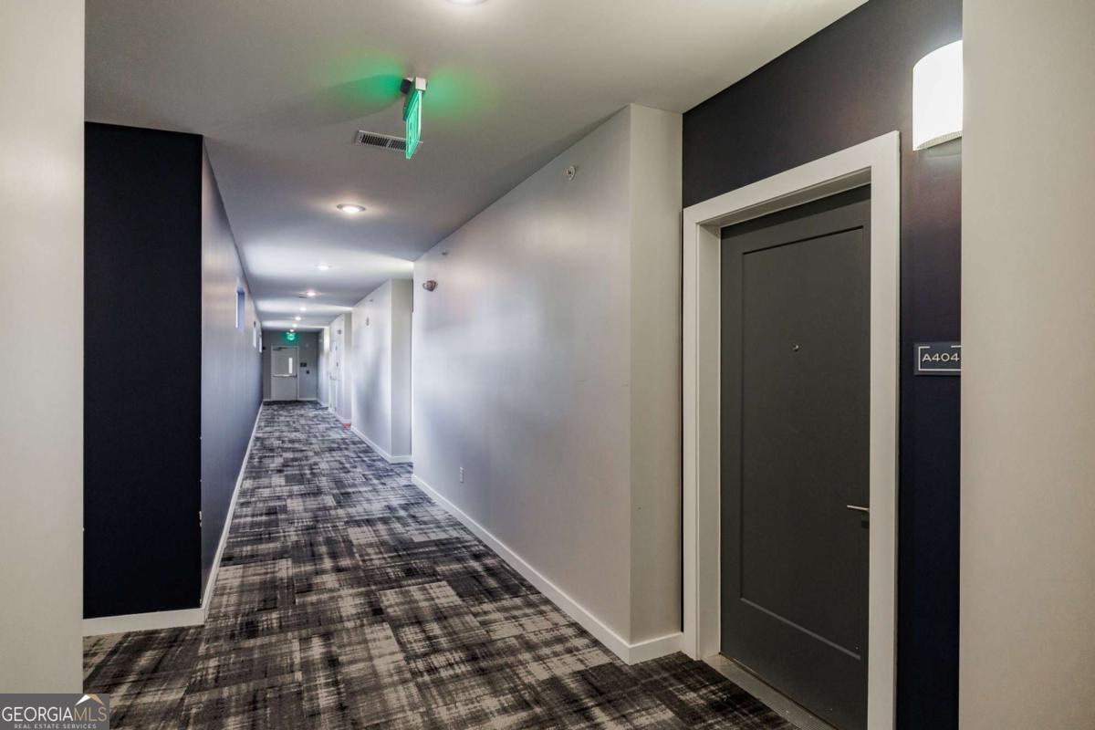 100 Prince Avenue, Unit A404 Athens, GA 30601 - Photo 7 of 27 a bathroom with a bathtub and a shower