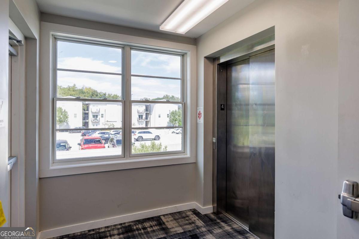 100 Prince Avenue, Unit A404 Athens, GA 30601 - Photo 9 of 27 a bathroom with a window
