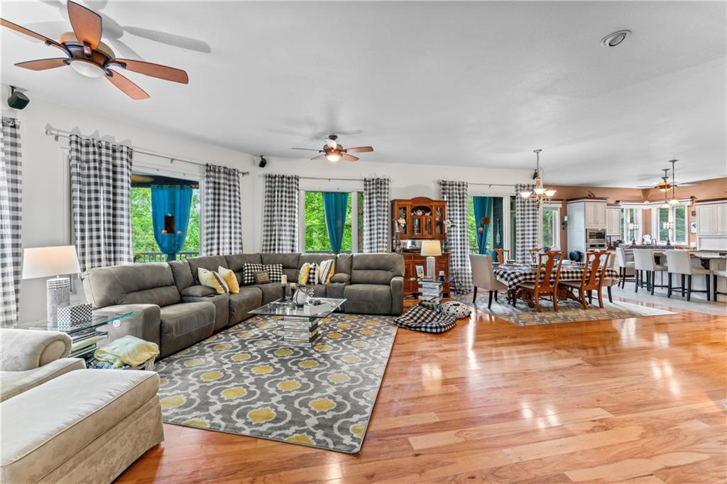 320 Holly Lane Walhalla, SC 29691 - Photo 33 of 41 This expansive open-concept living area features polished hardwood floors and abundant natural light.