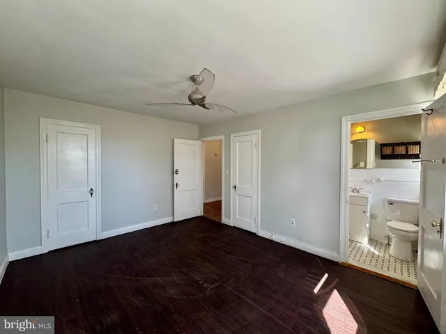 a view of an empty room and wooden floor