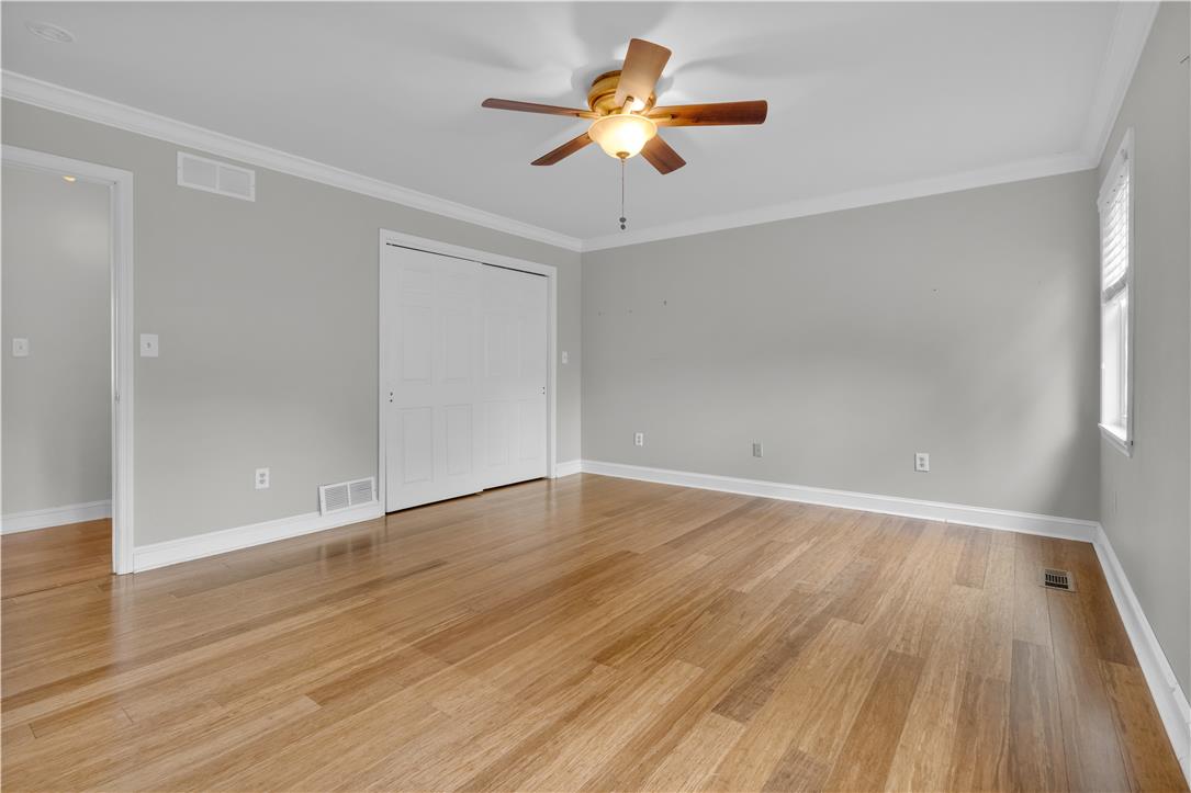 3396 Darien Road Bethlehem, PA 18020 - Photo 32 of 44 Hardwood flooring extends throughout this well-lit room, complemented by a convenient ceiling fan.