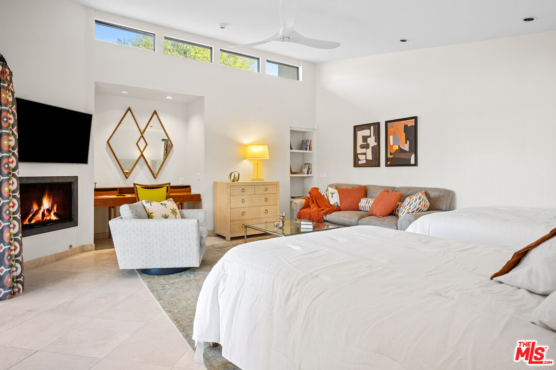 70461 Boothill Road Rancho Mirage, CA 92270 - Photo 62 of 68 a bedroom with a bed and a flat screen tv