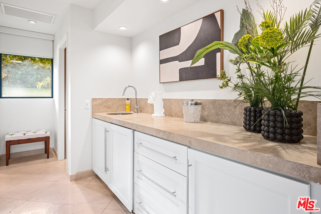 70461 Boothill Road Rancho Mirage, CA 92270 - Photo 64 of 68 a bathroom with a sink and a mirror