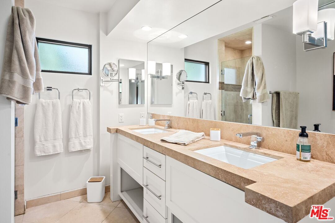 70461 Boothill Road Rancho Mirage, CA 92270 - Photo 66 of 68 a bathroom with a granite countertop sink mirror and a