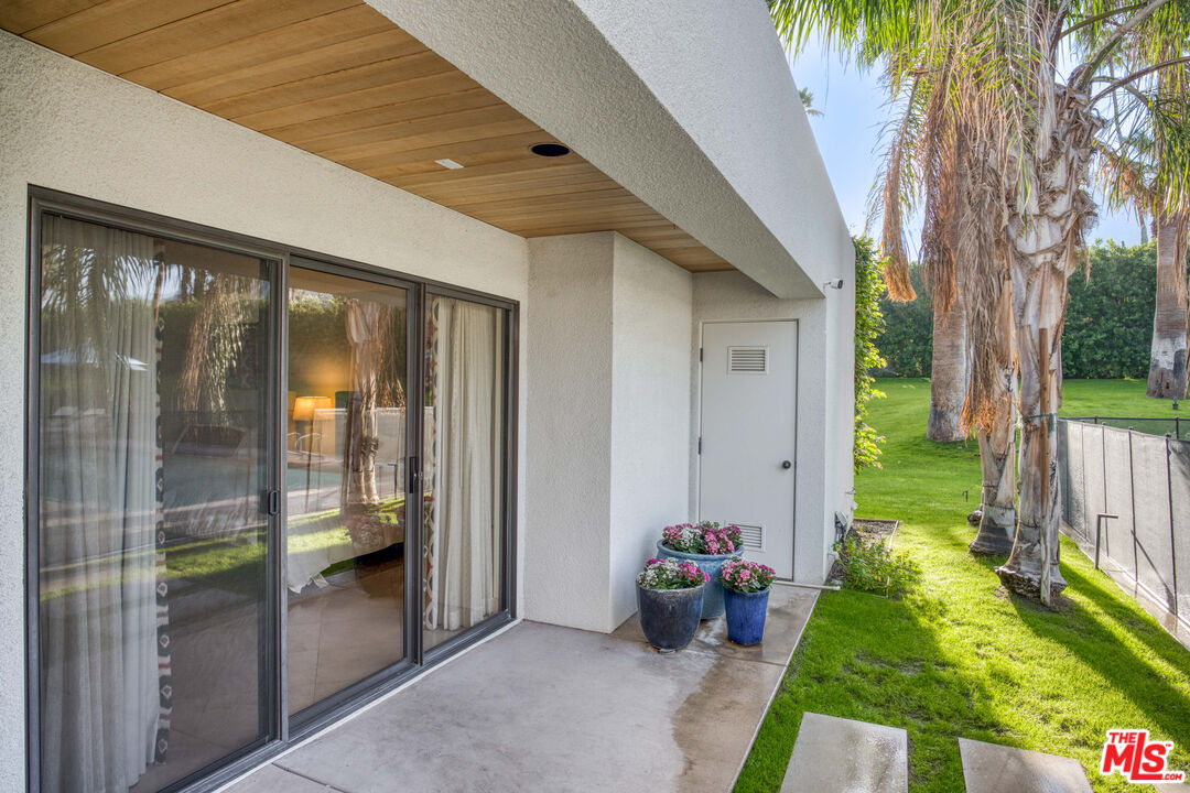 70461 Boothill Road Rancho Mirage, CA 92270 - Photo 68 of 68 a view of a porch with potted plants and a large window