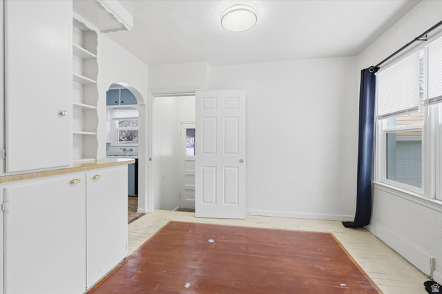744 North 500 East Logan, UT 84321 - Photo 8 of 29 Dining room looking to the back door and arches doorway into the kitchen