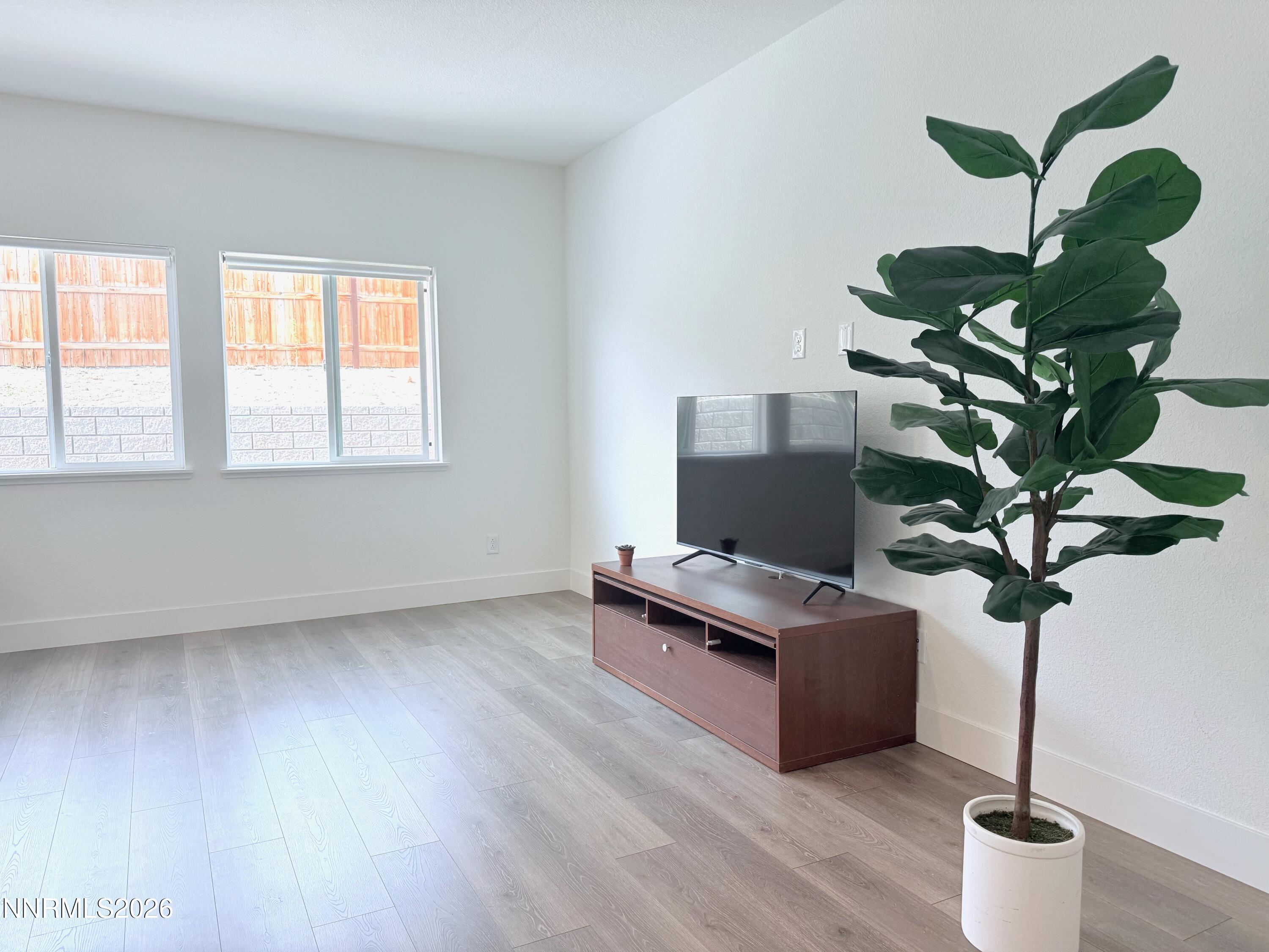 1433 Solitude Trail Reno, NV 89523 - Photo 13 of 35 a vase of flowers sitting on a table with a potted plant