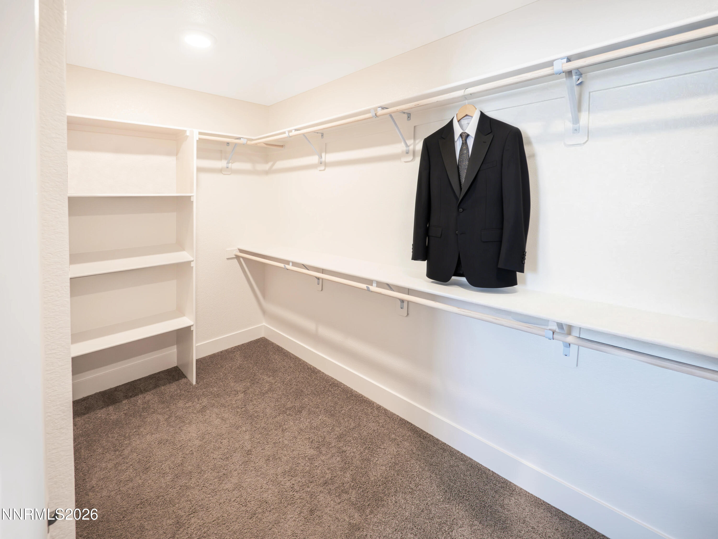 1433 Solitude Trail Reno, NV 89523 - Photo 23 of 35 a view of walk in closet with clothes and shoes