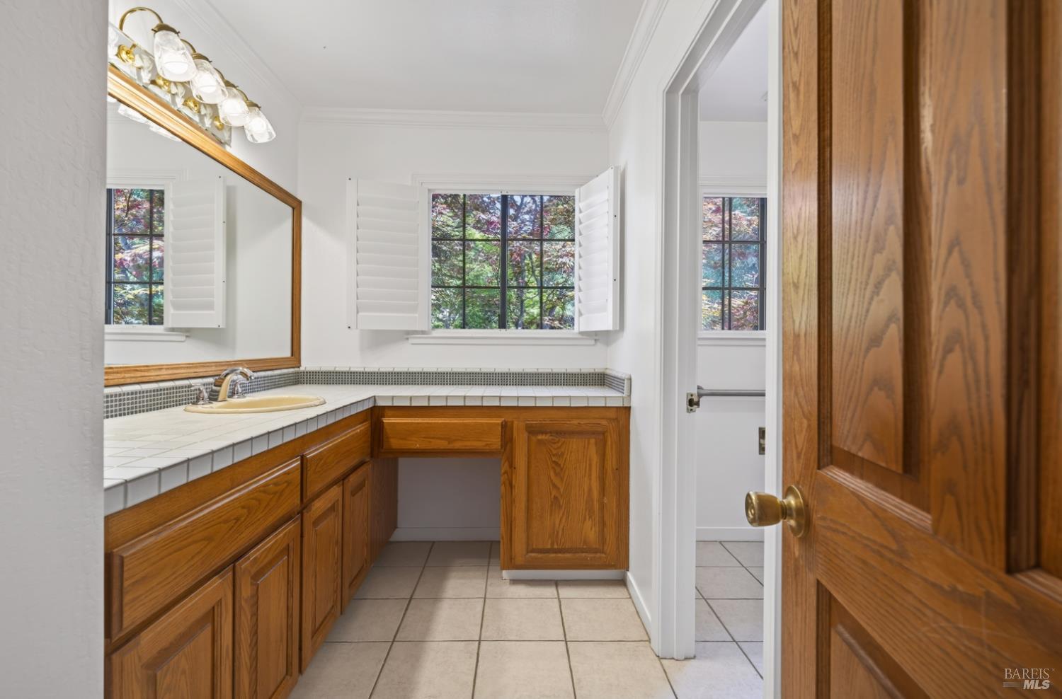 10 Lockton Lane Novato, CA 94945 - Photo 47 of 68 Upstairs hall bathroom with vanity, natural light, and convenient access from the upper-level living spaces.