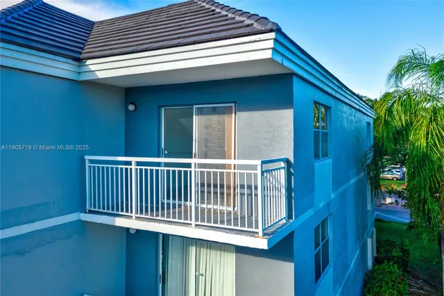 a view of a swimming pool with a patio and a garden