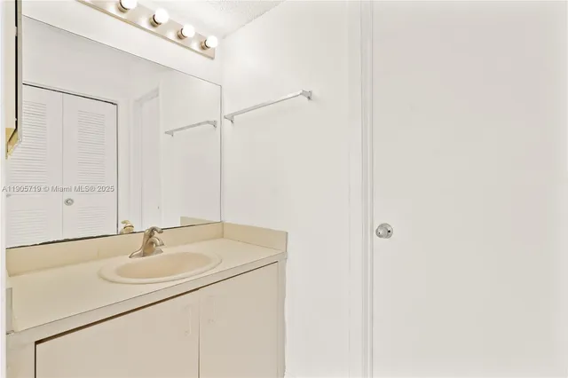a white toilet sitting next to a bath tub and shower