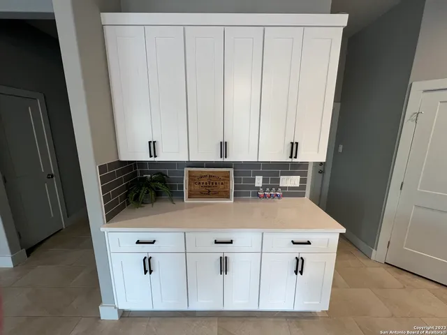 a bedroom with a bed and a table