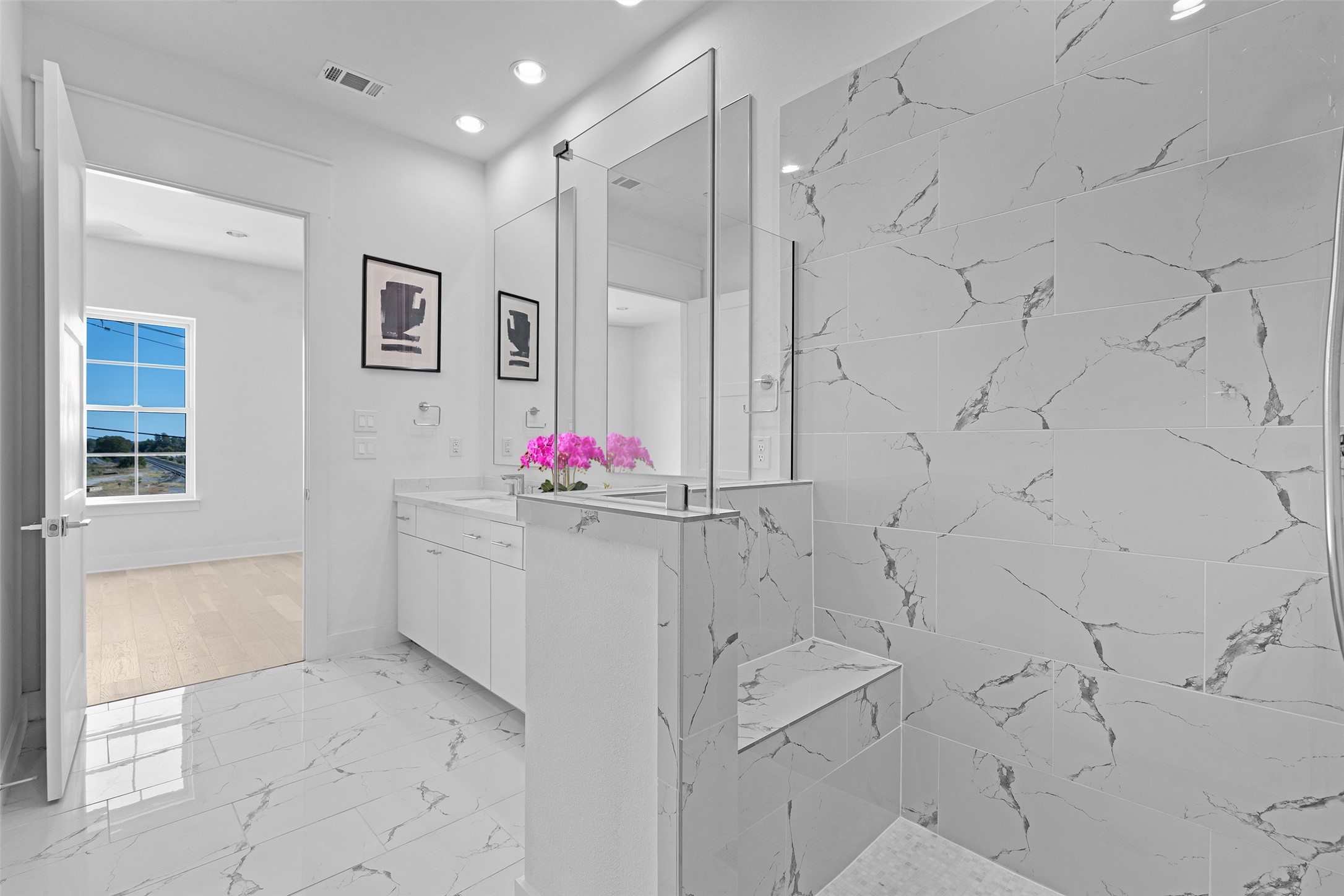 277 Pullman Court Round Rock, TX 78664 - Photo 15 of 28 Bathroom with light marble finish floors, vanity, a marble finish shower, and recessed lighting