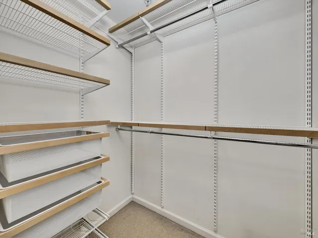 a view of an empty walk in closet