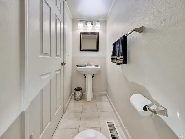 a bathroom with a sink and mirror