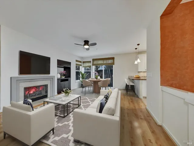 a living room with fireplace furniture and a flat screen tv