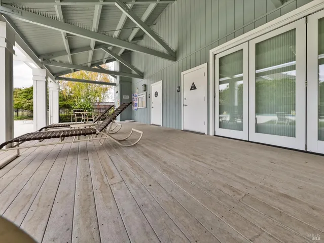 a view of outdoor space with wooden floor