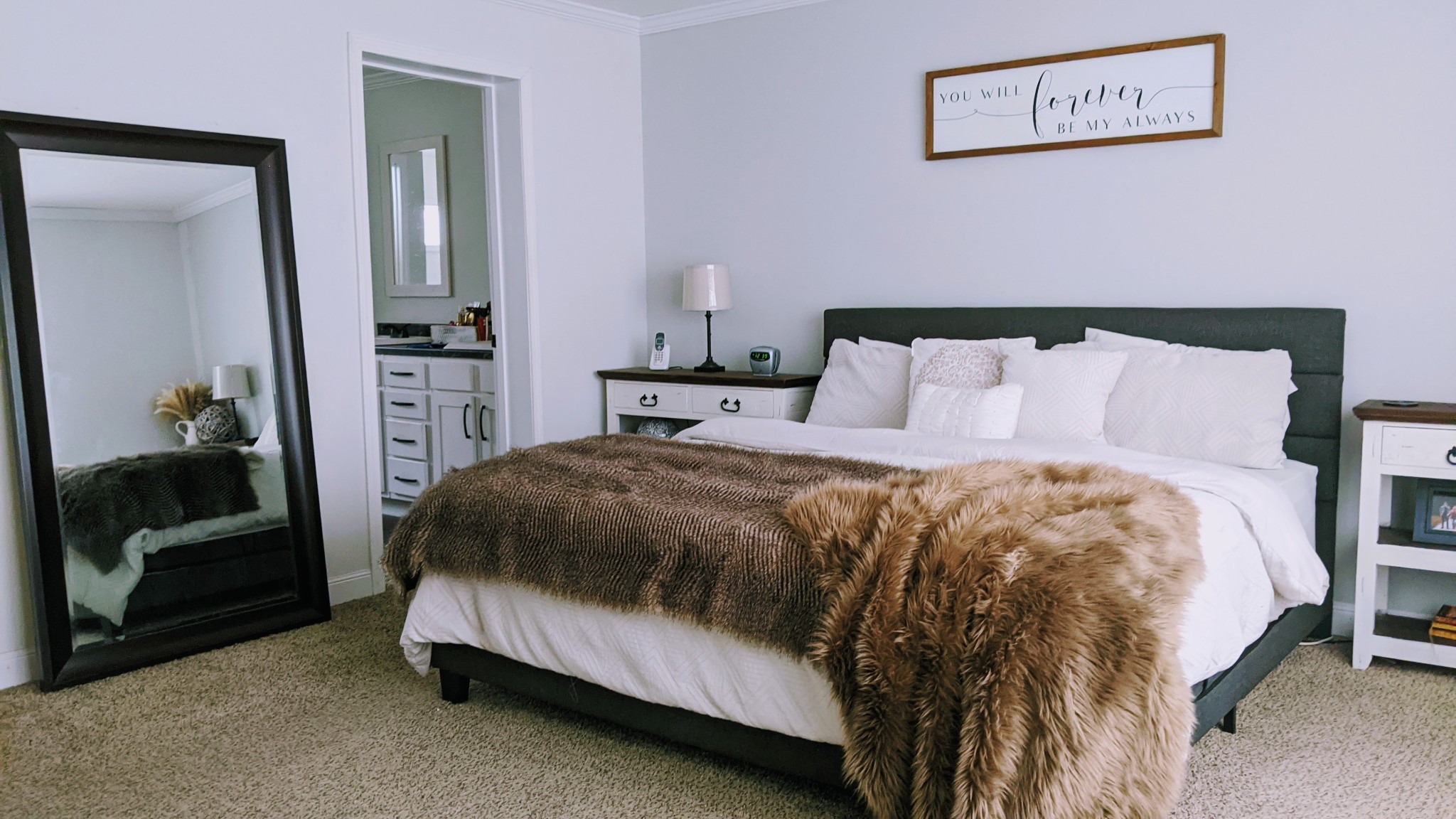 531 Pea Ridge Road Chestnut Mound, TN 38552 - Photo 47 of 91 a bedroom with a bed and a mirror