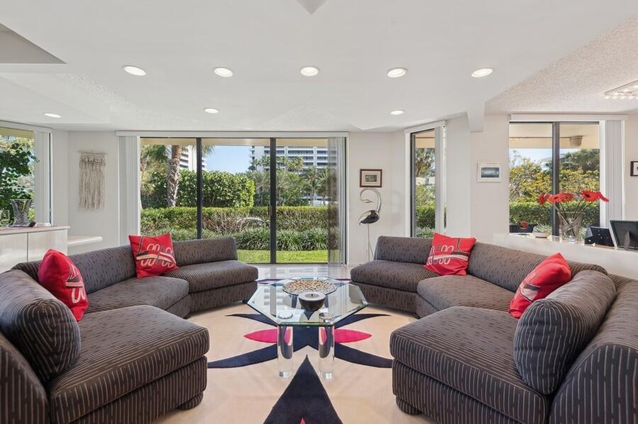 1401 South Ocean Boulevard, Unit 110 Boca Raton, FL 33432 - Photo 3 of 46 a living room with furniture and a large window