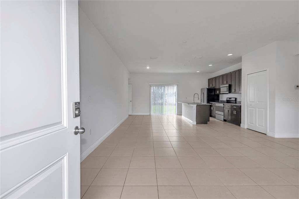 3650 Southwest 128th Place Ocala, FL 34473 - Photo 2 of 40 a view of a kitchen with a sink and a refrigerator