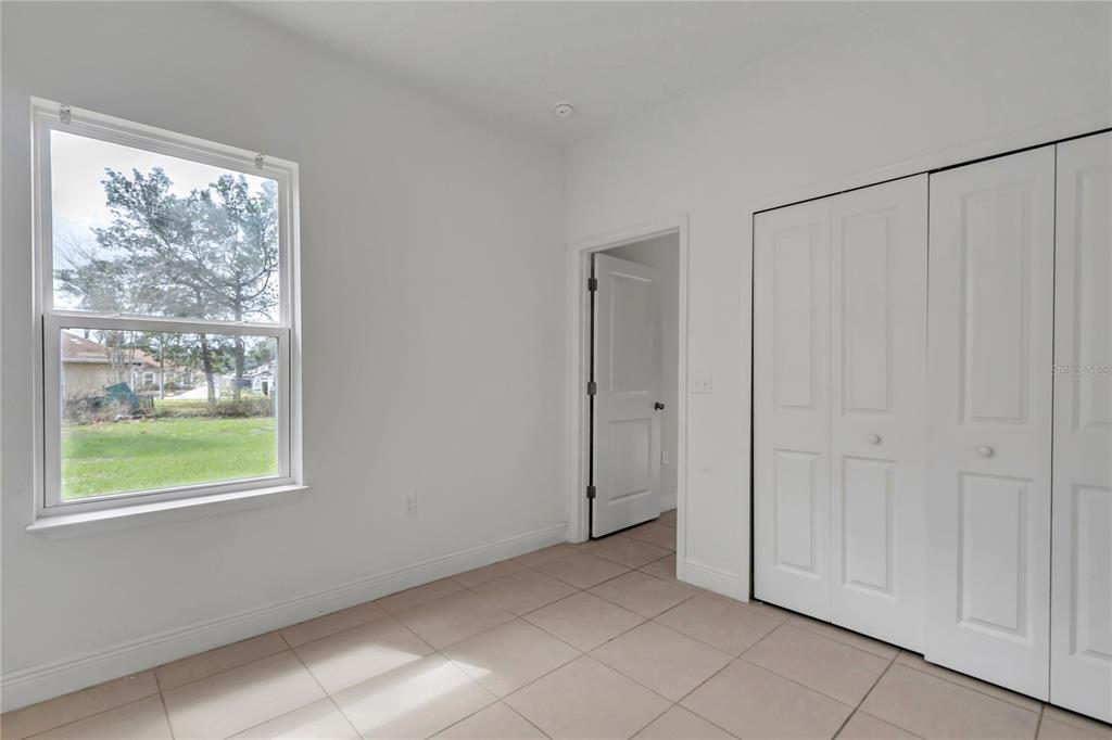 3650 Southwest 128th Place Ocala, FL 34473 - Photo 21 of 40 a view of an empty room with a window